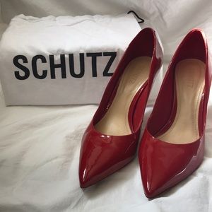 Red patent Schutz pumps